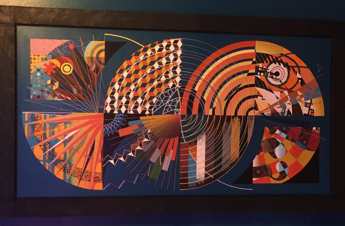 Tapestry (2020), a large geometric abstract painting by Russell Transue: interlocking circles built from radial lines, checkerboards, and concentric arcs in orange, cobalt blue, and teal.